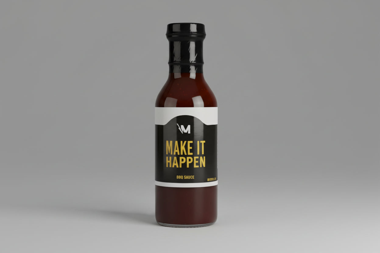 Barbecue sauce bottle with 'Make It Happen' label on a white background